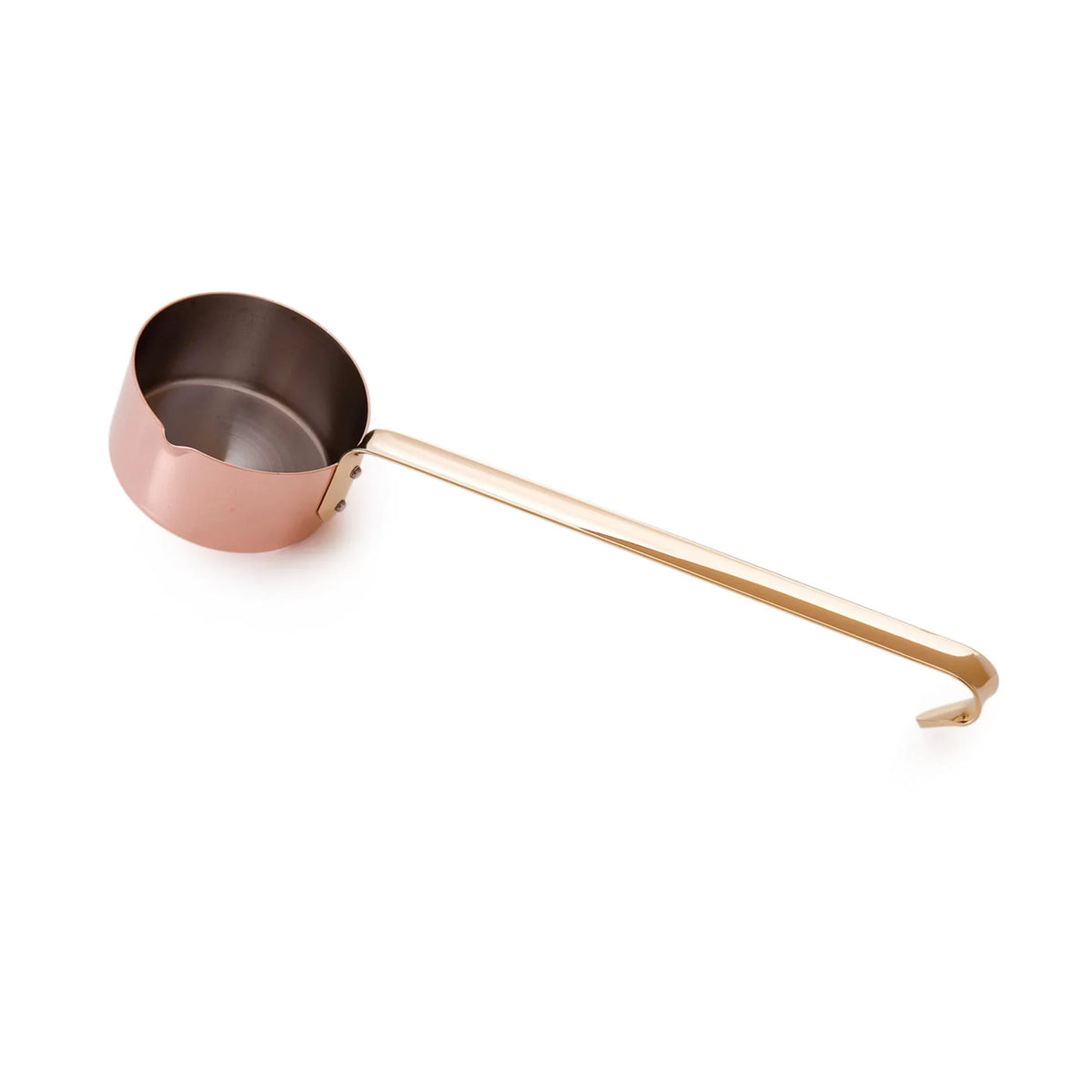 Copper melting pot with a long handle on a white background.