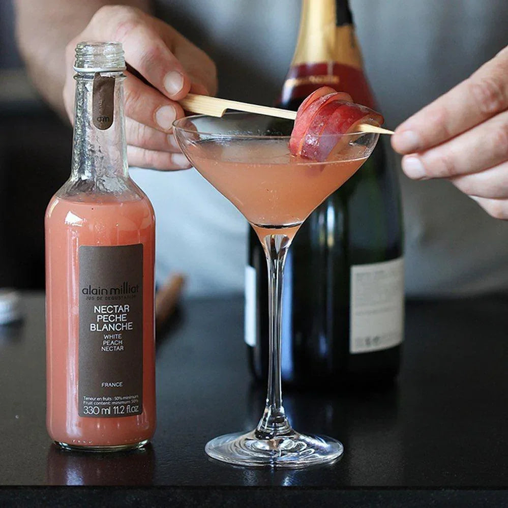 French white peach nectar cocktail with fresh peach garnish, artisan-made and premium quality