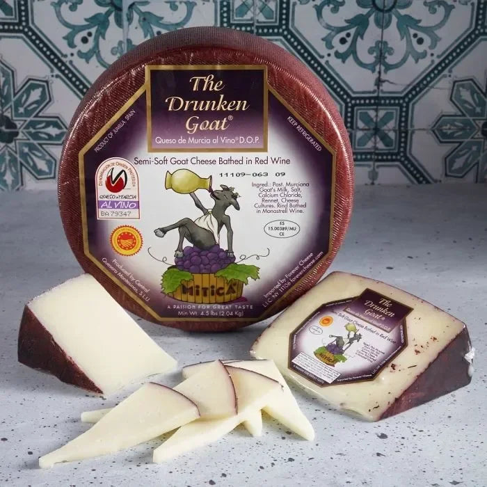 Semi-soft goat cheese bathed in red wine, artisan-made with natural ingredients, sliced for tasting