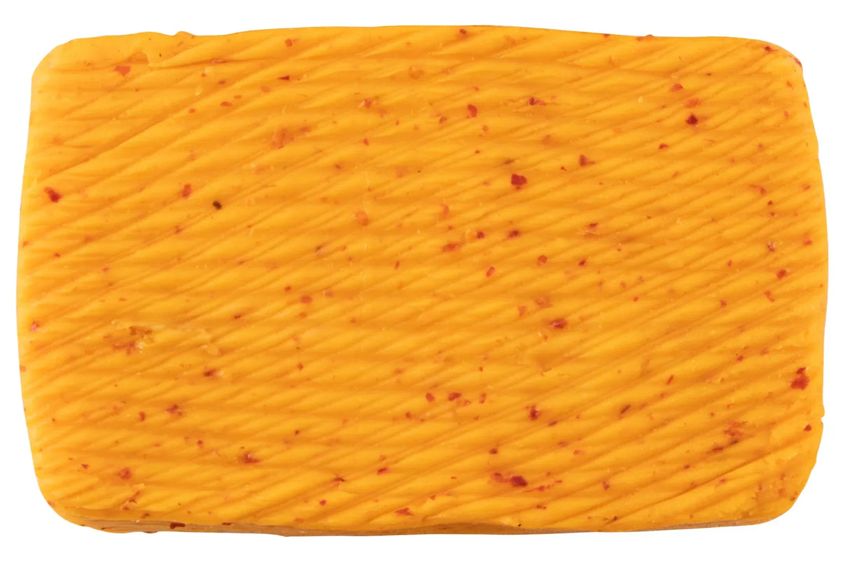 Bordier Espelette pepper butter block, ridged texture flecked with red pepper, hand-churned French butter