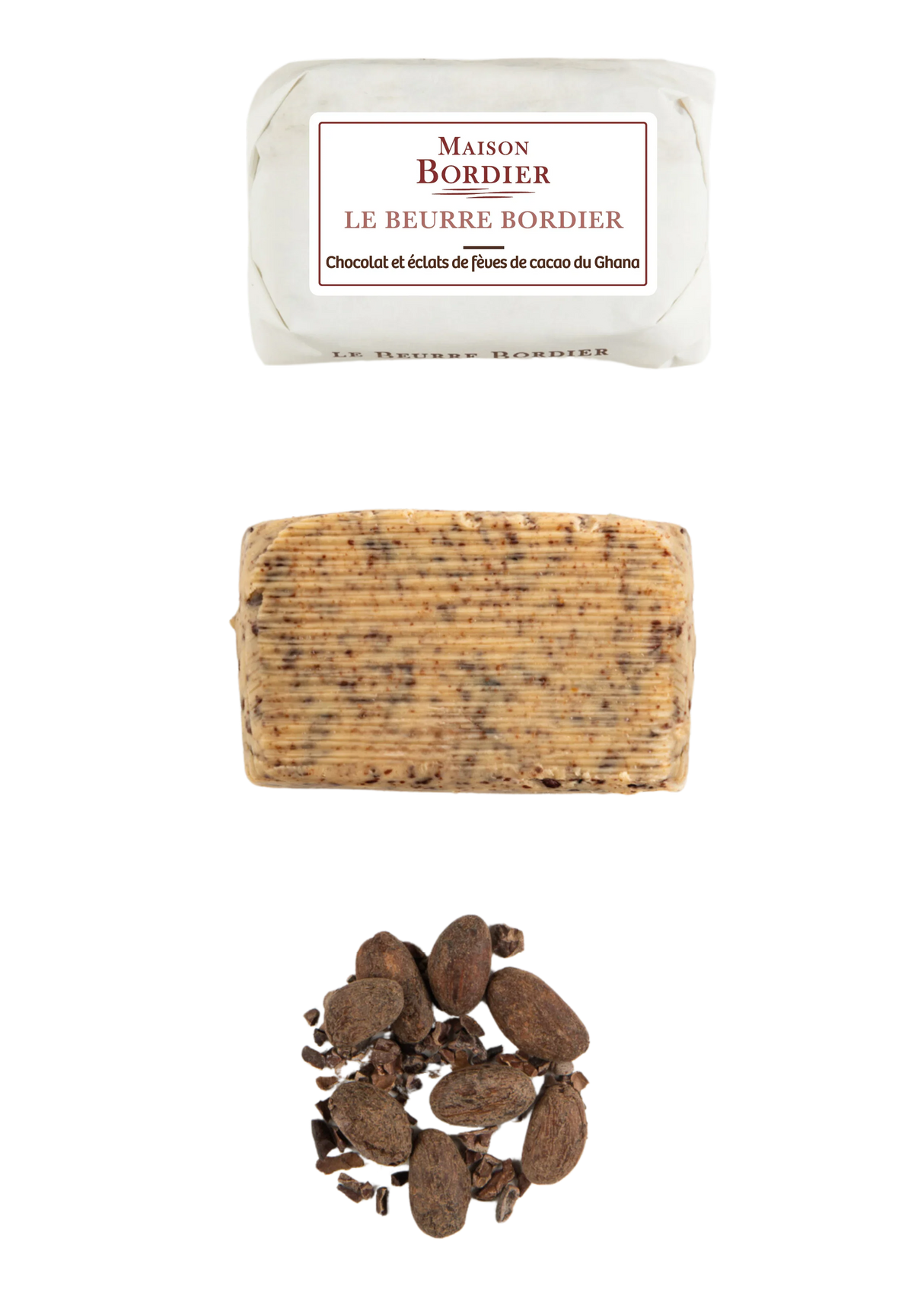 French butter with chocolate and cocoa nibs, unwrapped log, and whole cocoa beans