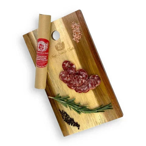 Artisan salami slices on wooden board with rosemary, pink salt, and peppercorns — premium, clean-label charcuterie