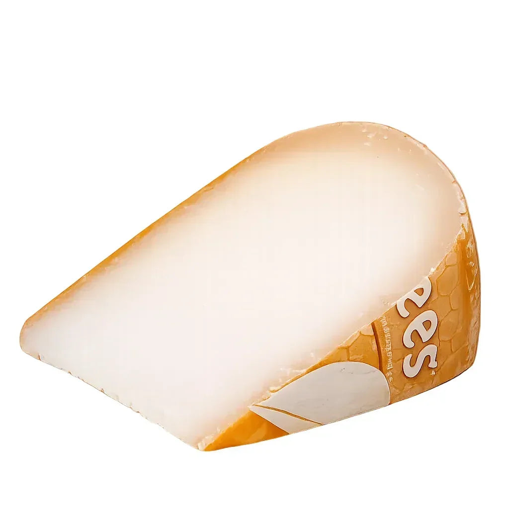 Wedge of artisan French cheese with natural rind, creamy white interior, premium quality, gluten-free, keto-friendly