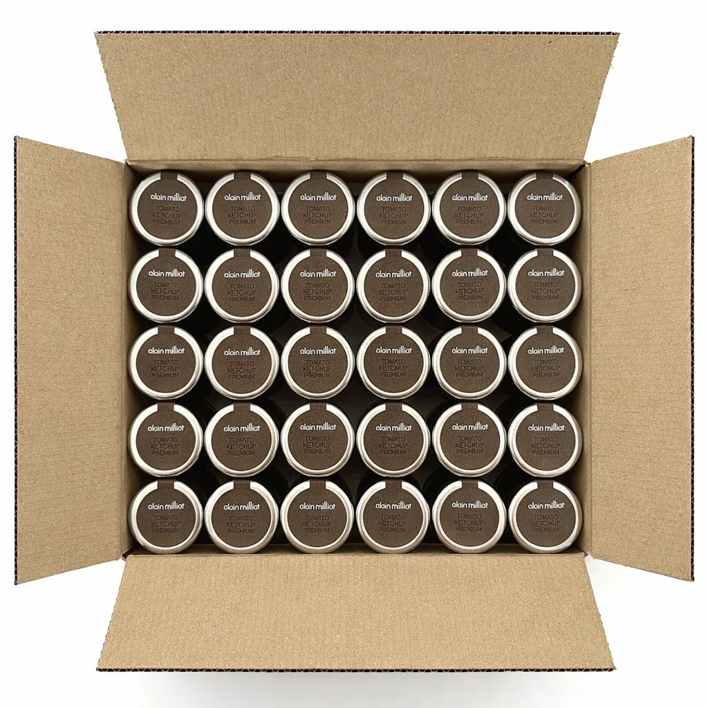 Open box of Alain Milliat premium tomato ketchup jars neatly arranged in rows