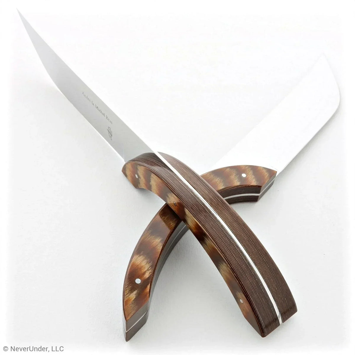 Elegant artisan knives with tortoiseshell handles, perfect for premium French cuisine prep.