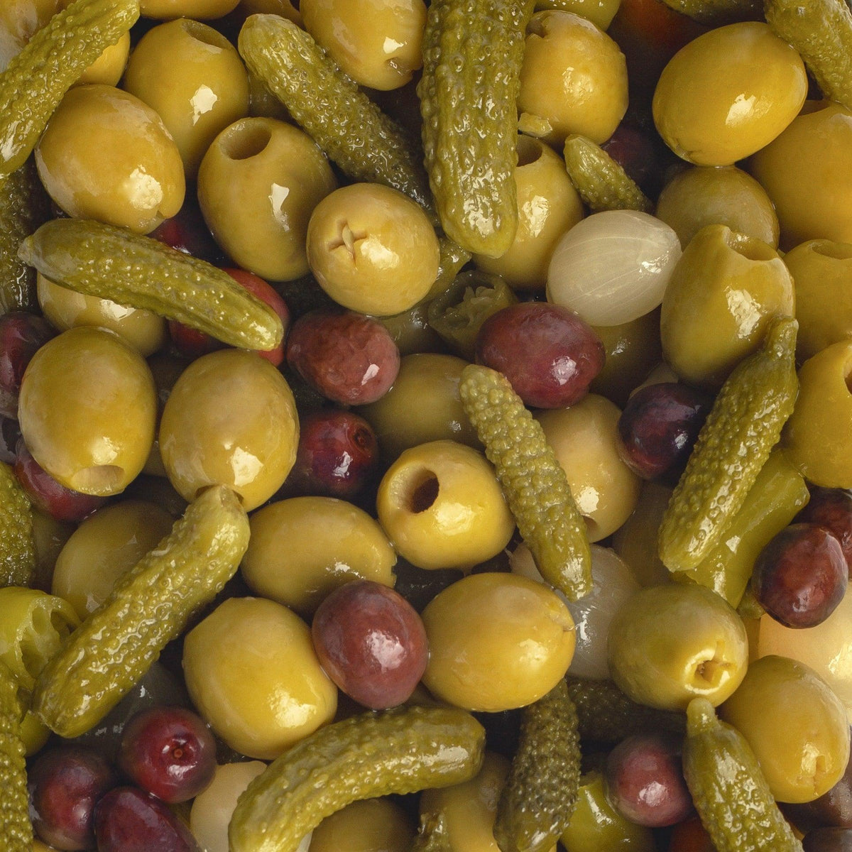 Green olives, pickles, and red olives in a gourmet mix, artisan-made and premium quality
