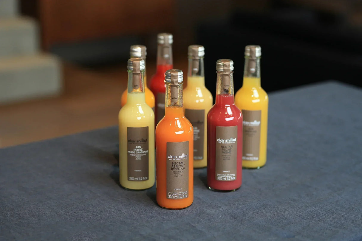 Assorted French fruit nectars and juices in glass bottles, artisan-made and premium quality