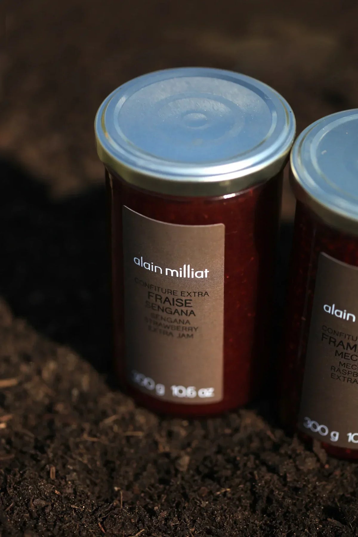 Alain Milliat strawberry extra jam in rustic setting, artisan-made French preserve