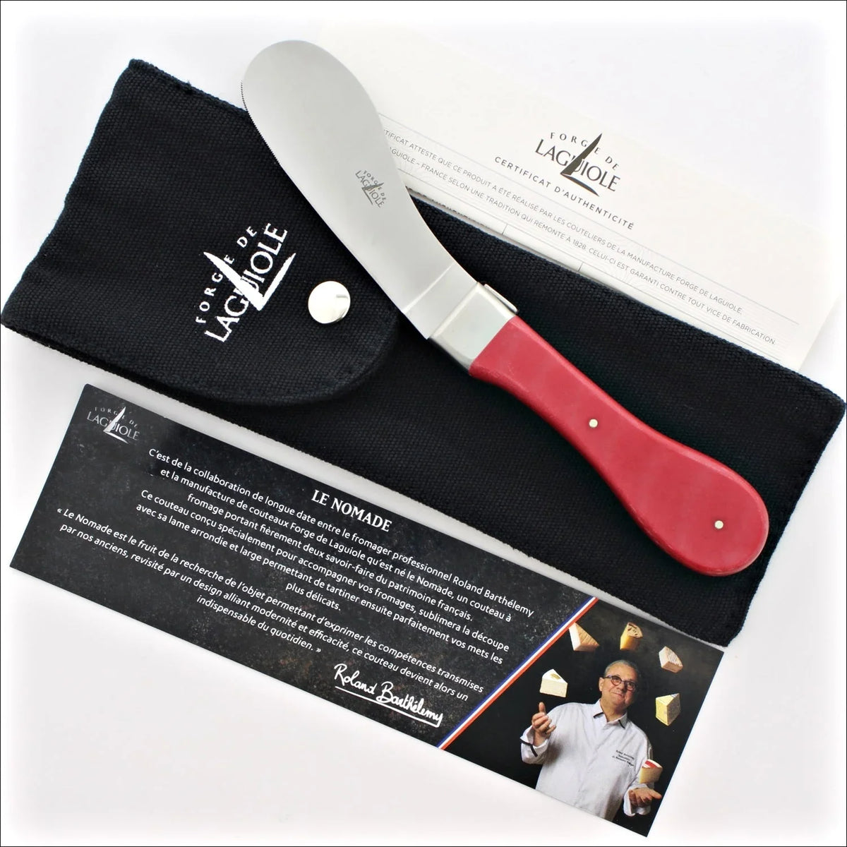 Forge de Laguiole cheese knife with a red handle and black protective pouch.