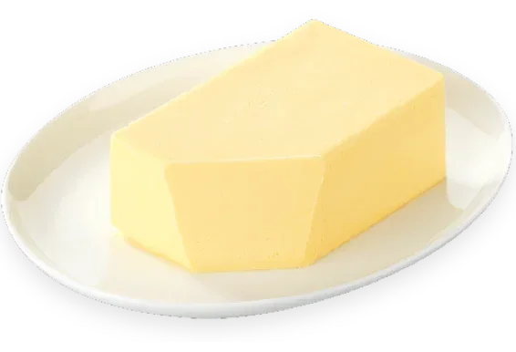 Premium French butter block on white plate, artisan-made, grass-fed, all-natural