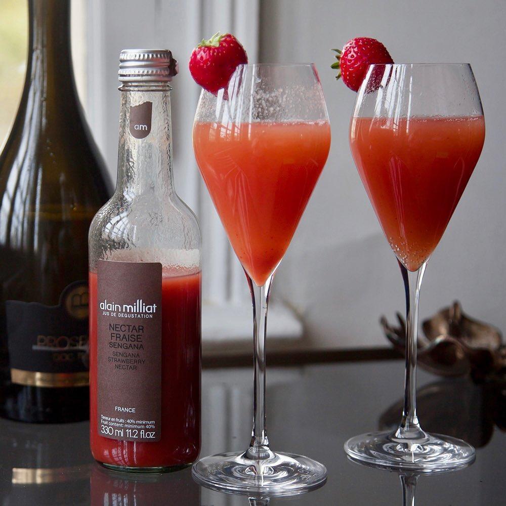 Strawberry nectar in champagne flutes with fresh strawberries, paired with French sparkling wine