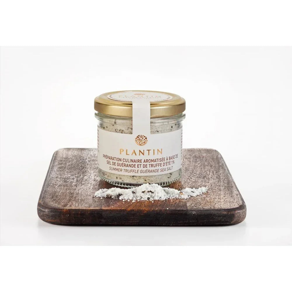Summer truffle Guérande sea salt in glass jar with gold lid, artisan culinary preparation