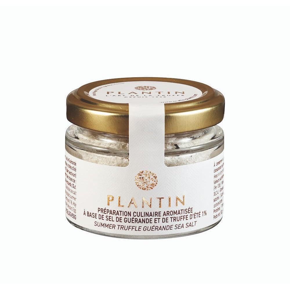 Summer truffle Guérande sea salt in elegant glass jar with gold lid, artisan culinary preparation