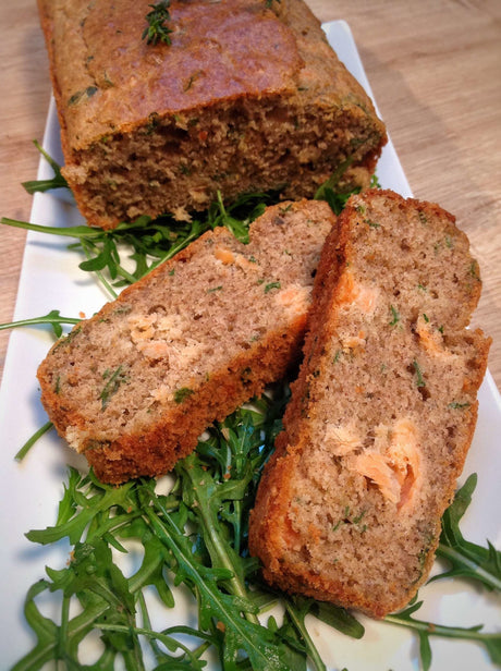 Sliced savoury buckwheat loaf with smoked trout, arugula and Bordier seaweed butter