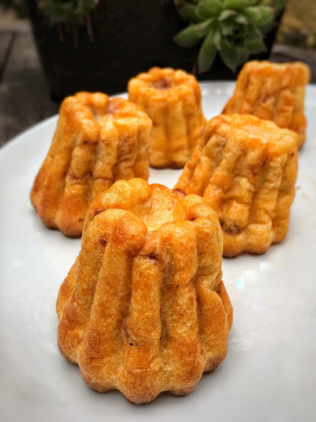 Savory cannelés with chorizo and Emmental made with Espelette pepper butter