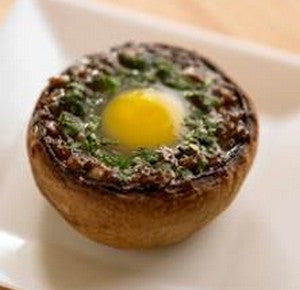 Baked stuffed mushroom caps with Bayonne ham, quail egg and Bordier Espelette pepper butter