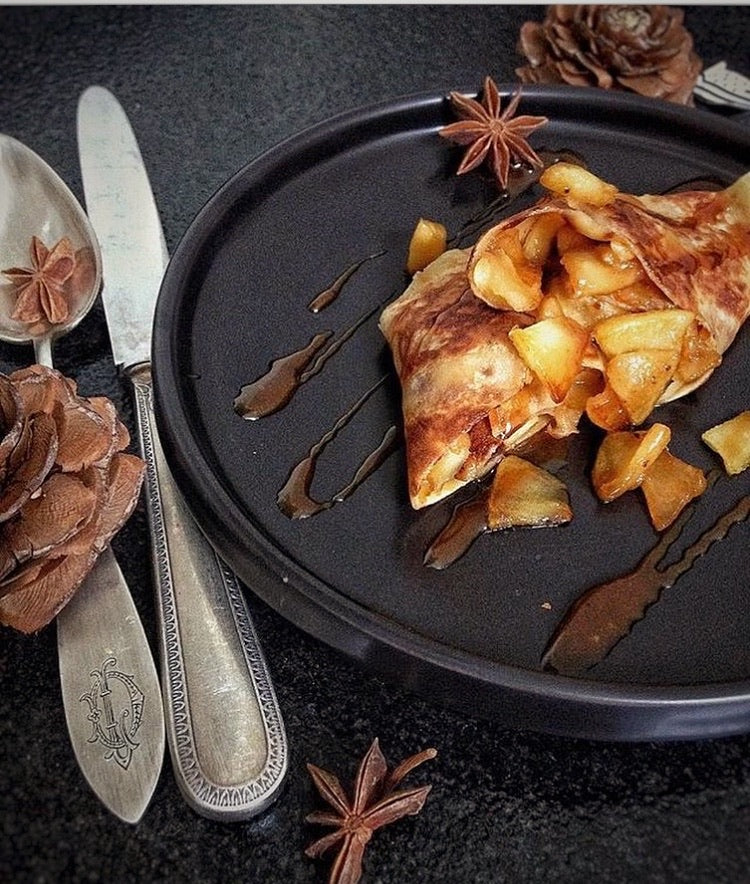Folded crepes filled with caramelized apples and drizzled with salted butter caramel