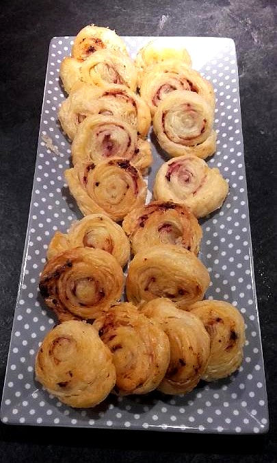 Small golden hazelnut cakes made with Bordier raspberry butter, cooling on a rack