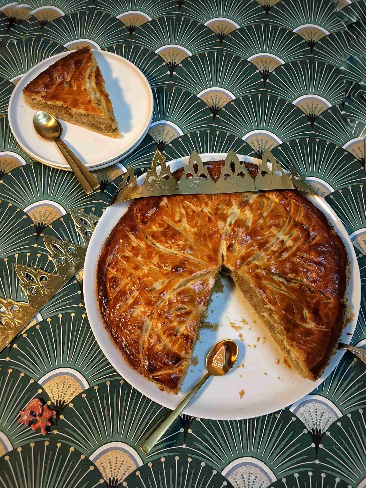 Golden galette des rois filled with vanilla butter almond cream and caramelized pears