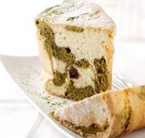 Sliced matcha marble travel cake made with Bordier semi-salted butter and amarena cherries