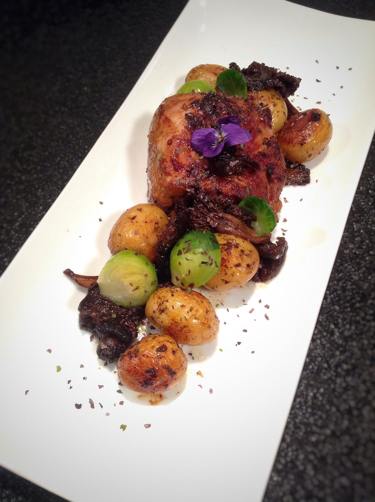 Pork filet mignon steaks with new potatoes, Brussels sprouts and wild mushrooms, cooked in Bordier seaweed butter