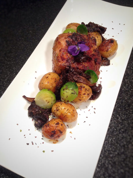 Pork filet mignon steaks with new potatoes, Brussels sprouts and wild mushrooms, cooked in Bordier seaweed butter