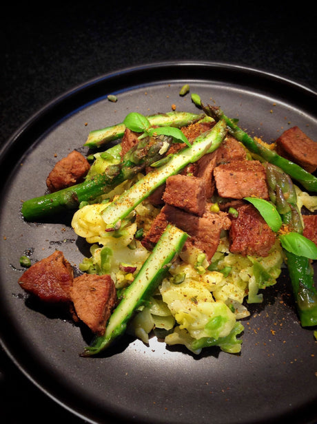 Spiced veal stew with green cabbage, pistachios and sliced almonds
