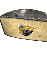 Poacher's Cheddar English cheddar cheese with balsamic onions wedge wrapped in plastic