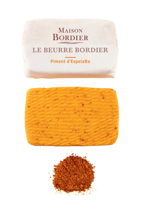 Maison Bordier Espelette pepper butter with packaging, butter slab, and spice on white background