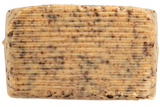 Rectangular bar of artisanal French butter with cocoa, ribbed texture, visible cocoa flecks