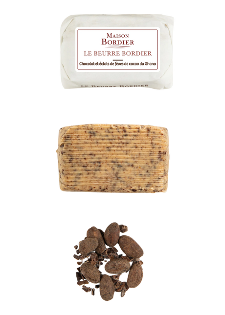 French butter with chocolate and cocoa nibs, unwrapped log, and whole cocoa beans