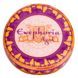 Ewephoria aged sheep's milk cheese wheel with purple and orange decorative rind