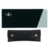 Forge de Laguiole black rectangular box and black leather knife sheath with silver studs.