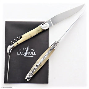 Traditional French folding knife with horn tip handle, awl, and corkscrew on white background.