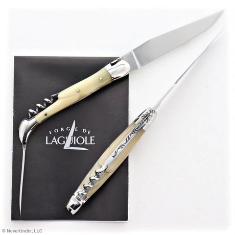 Traditional French folding knife with horn tip handle, awl, and corkscrew on white background.