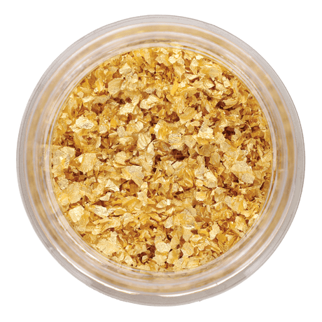Glass jar filled with edible 23-carat gold flakes, gourmet French pantry ingredient
