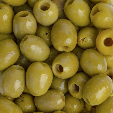 Closeup of premium whole green Gordal olives, glossy and fresh, from The French Pantry.