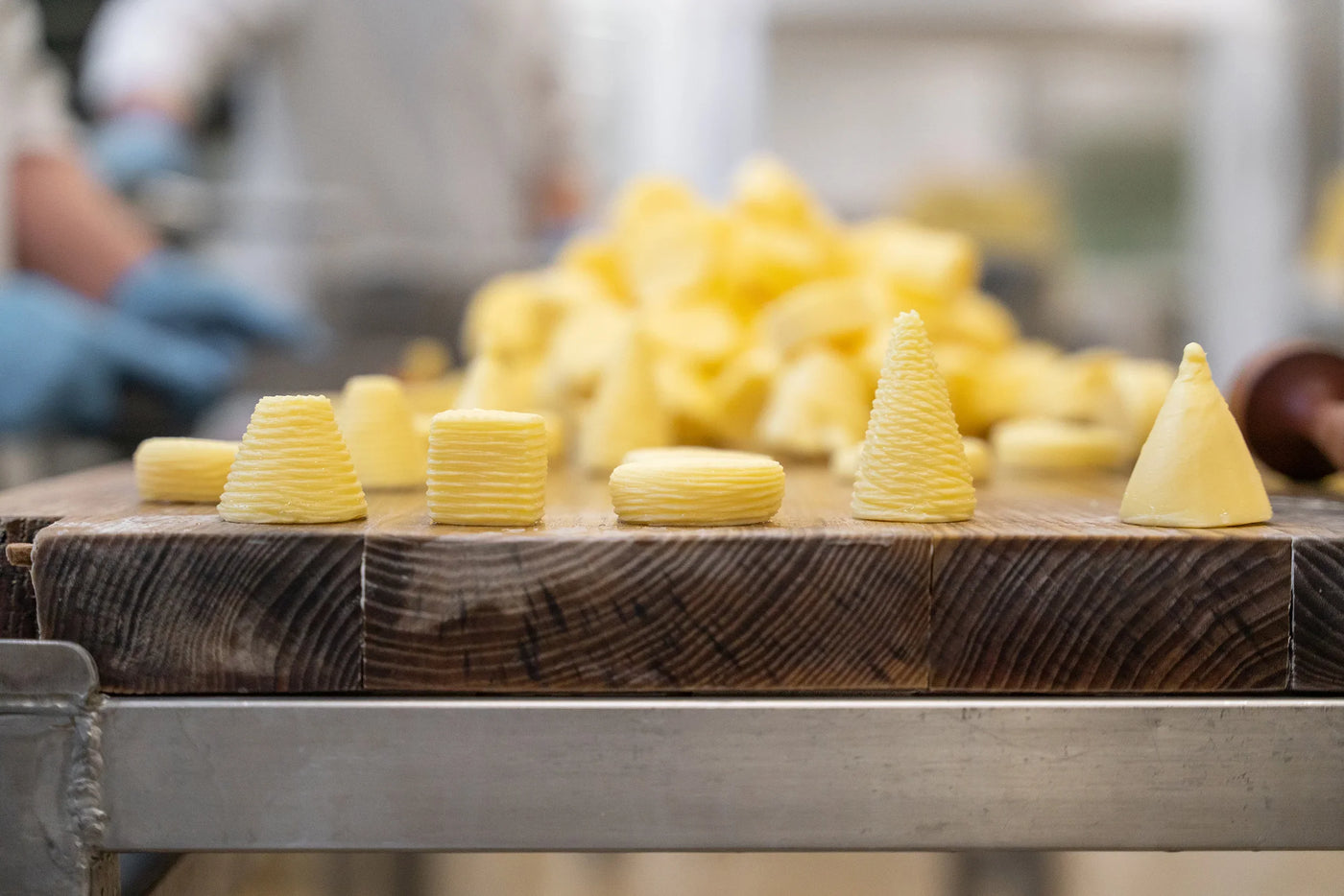 Artisan French butter bordier shapes on wooden board, premium quality, all-natural, small-batch