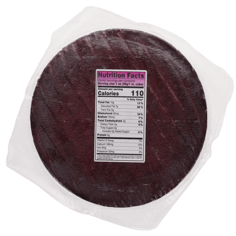 Whole round Drunken Goat cheese wheel back in plastic wrap with nutrition facts label