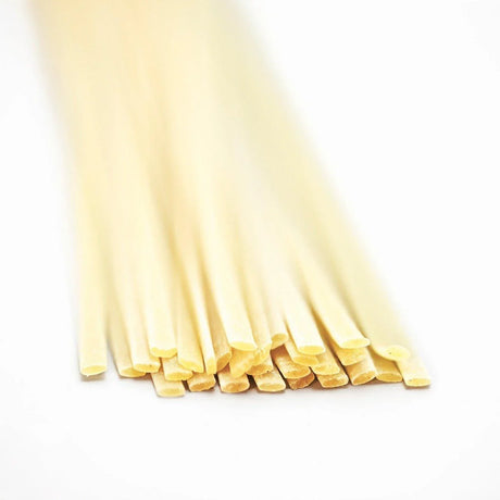 Artisan linguine pasta on white background, premium imported pantry staple