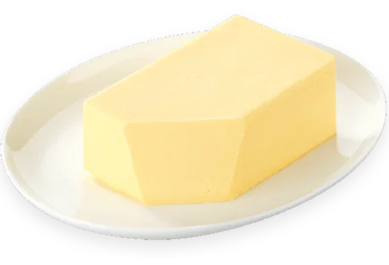 Block of butter on a white plate with a white background
