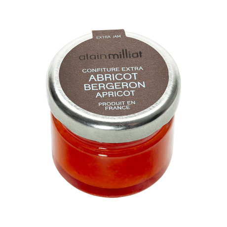 Small jar of Alain Milliat Apricot Bergeron Extra Jam with a silver lid.