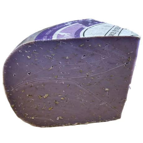 Whole wheel of Lavender Pesto Gouda cheese from Holland