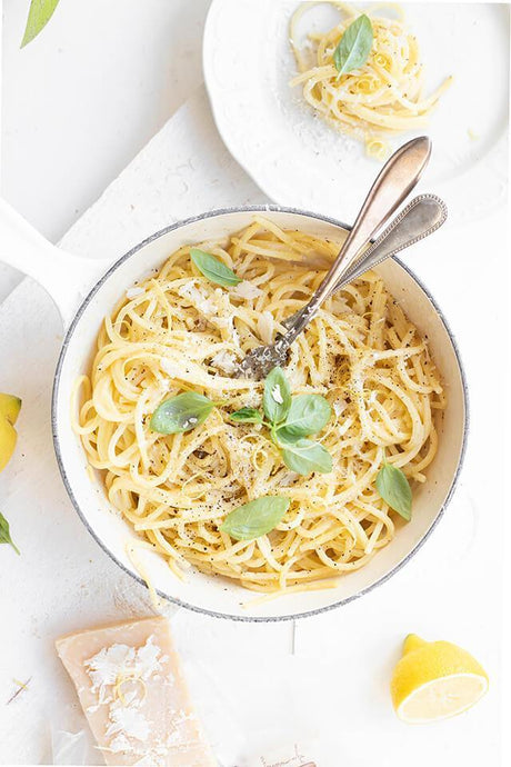 Spaghetti with Parmigiano Reggiano, basil, and lemon in a white pan, French Pantry premium cheese